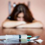 woman suffering from opioid use disorder and co-occurring disorders without mental health treatment is why relapse happens to her using heroin again